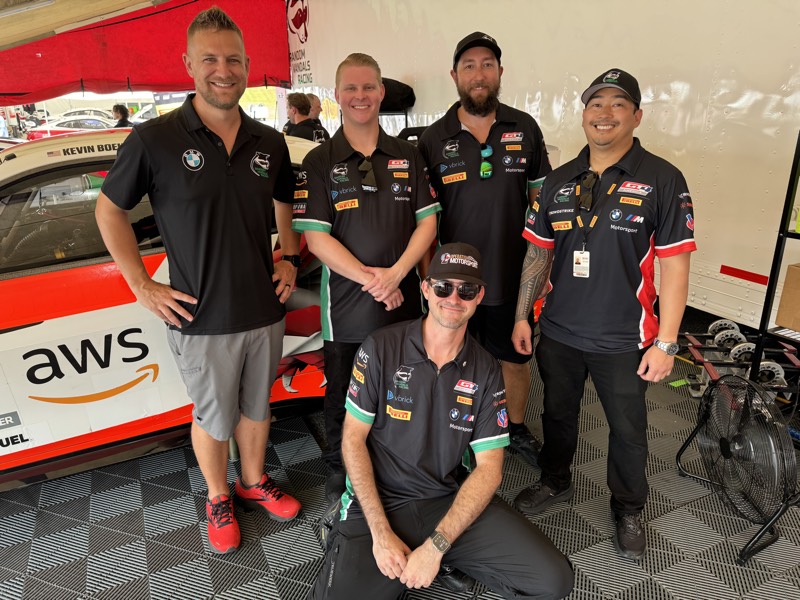 Team photo under the tent with BMW race car